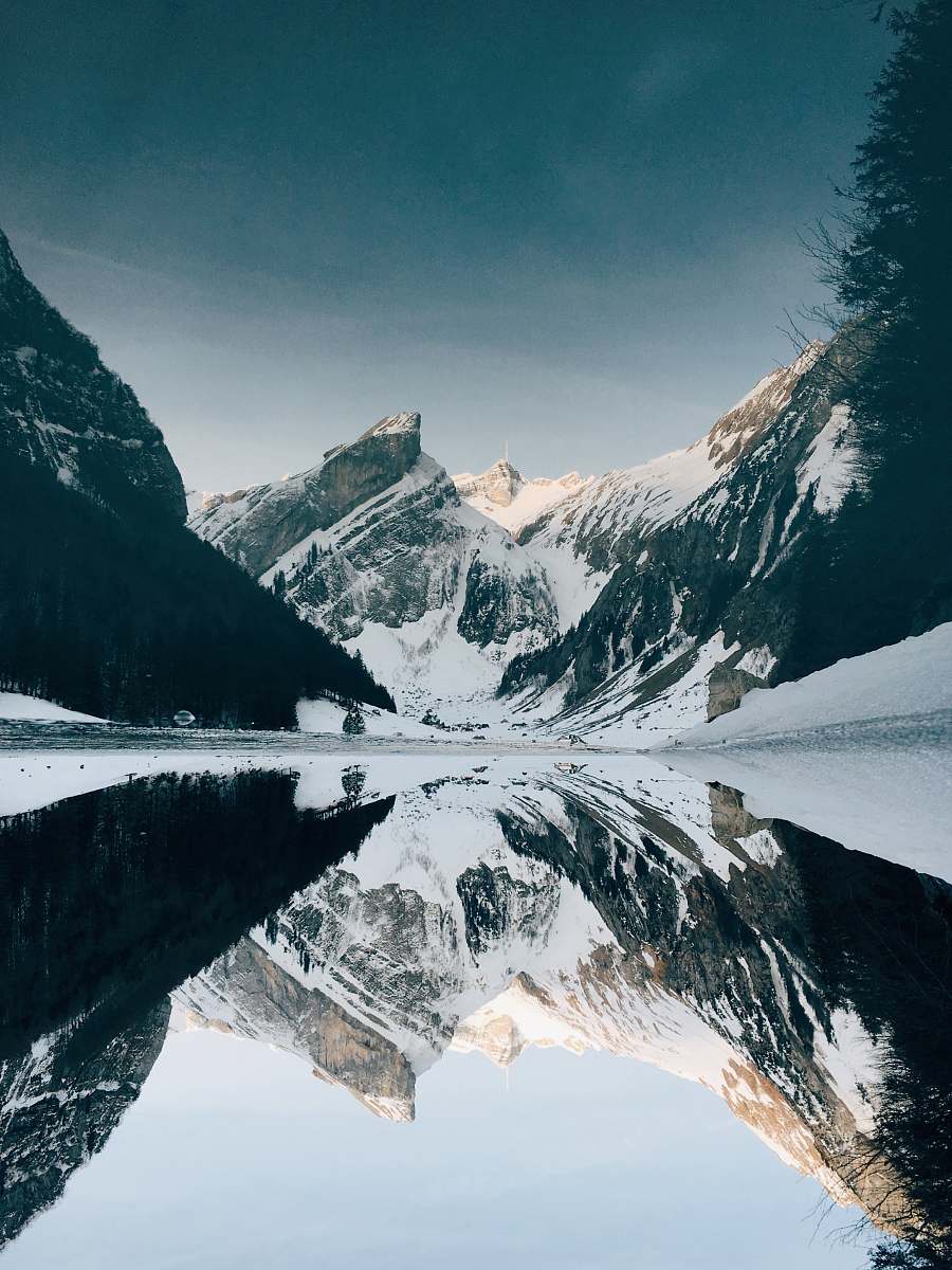 snow snow-covered mountain near lake under blue sky mountain