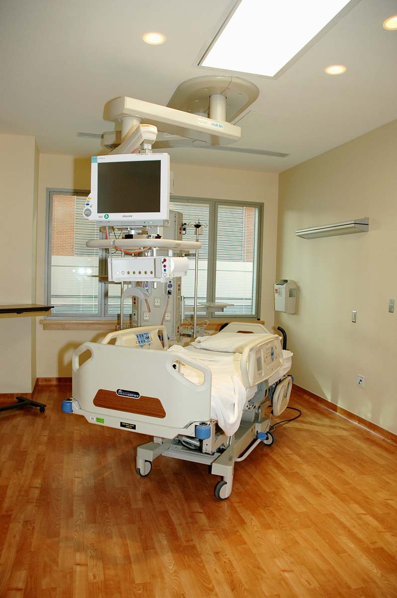 hospital white hospital bed near white wall monitor