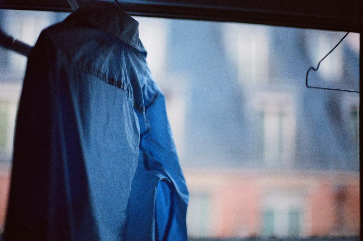 person blue jacket on black frame doctor