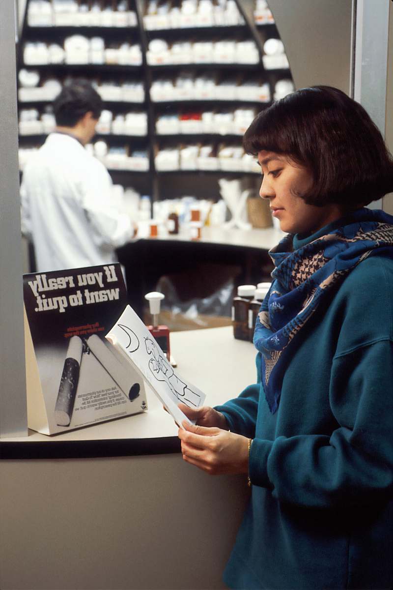 person boy in blue hoodie reading book apparel