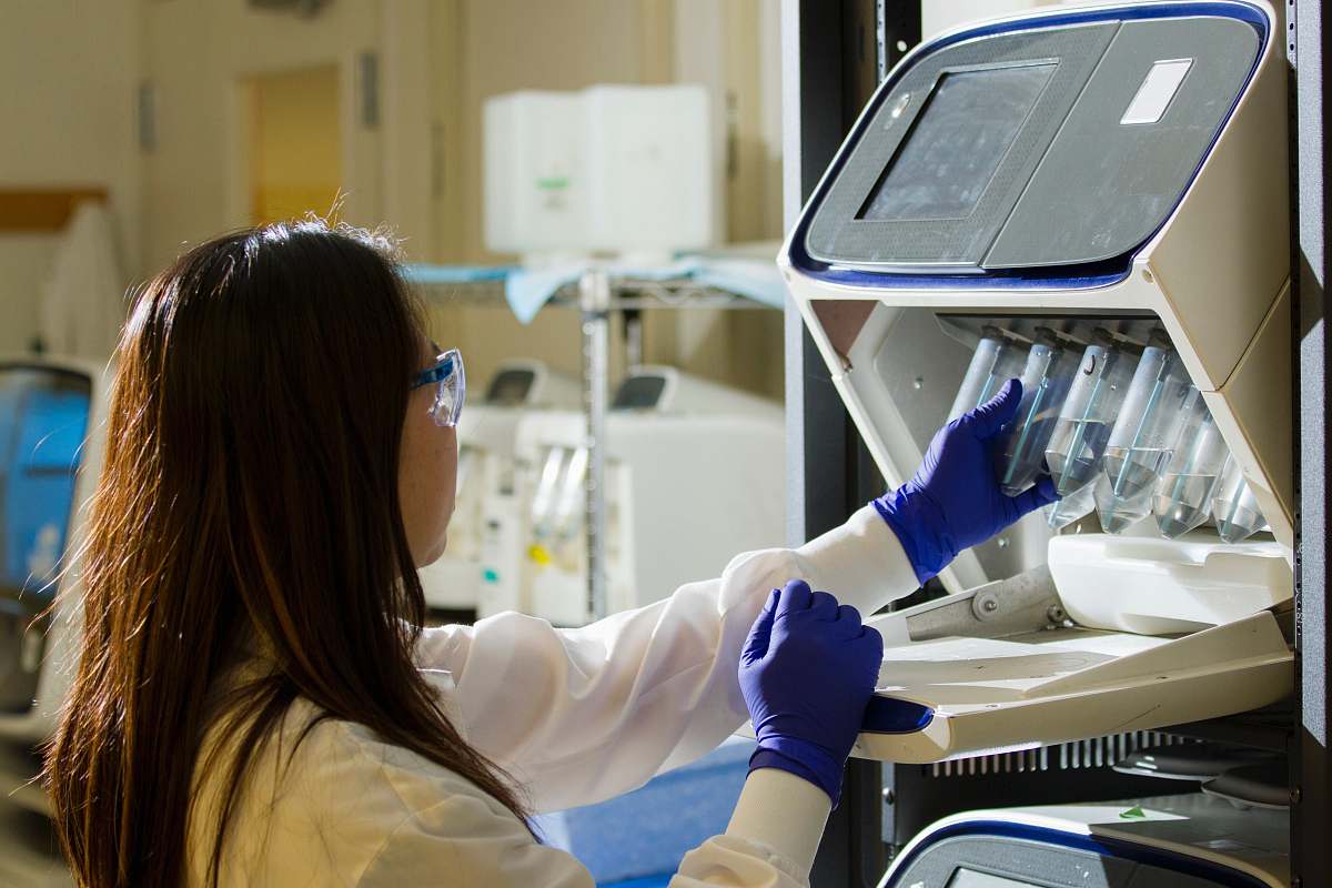 person woman holding test tubes lab