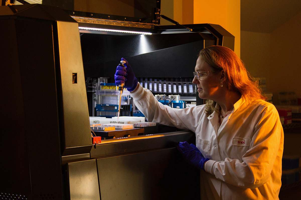 lab woman in white long-sleeved top scientist