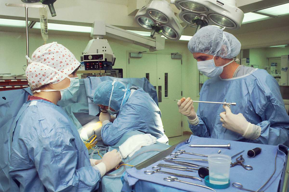 human people in blue scrub suit sitting on chair surgeon