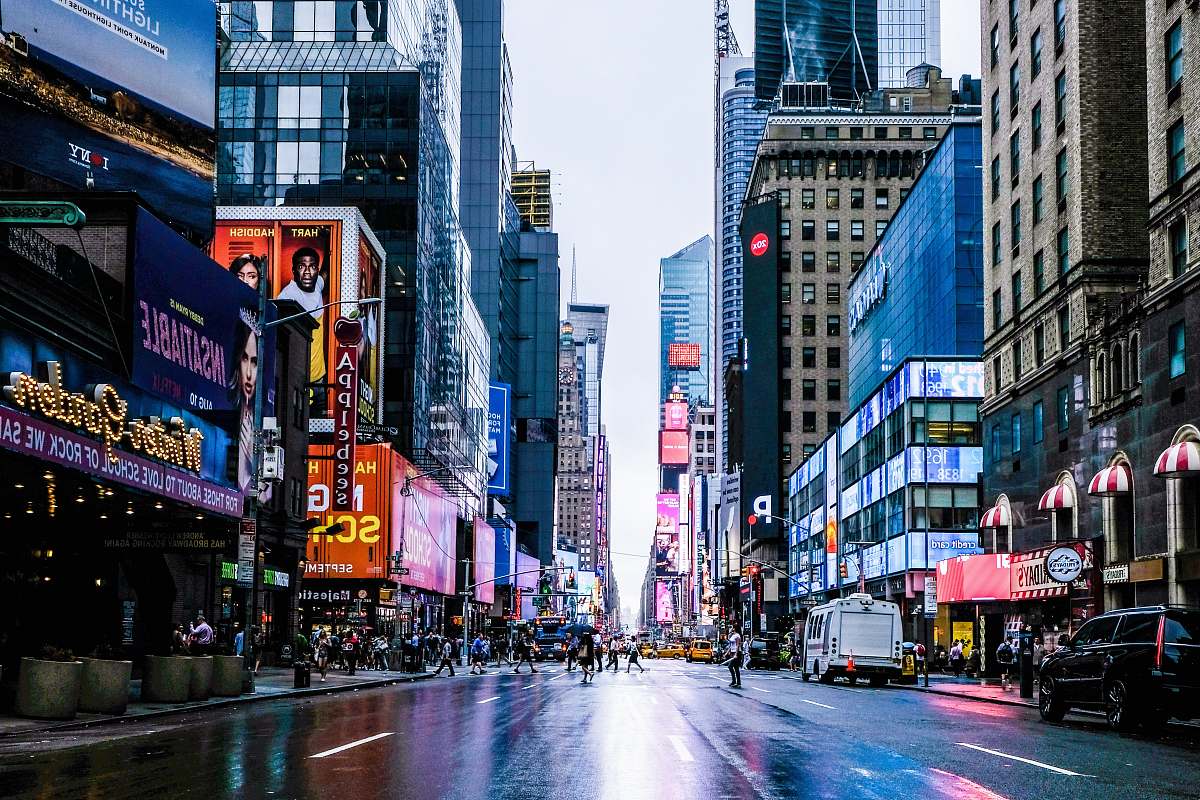 urban people on road during daytime city
