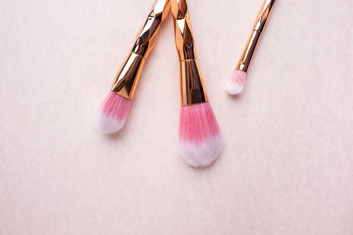 gold-colored makeup brushes