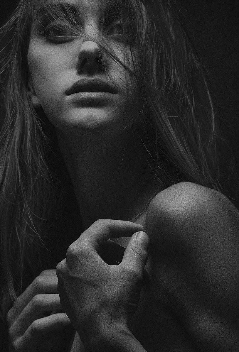 woman touching her shoulders