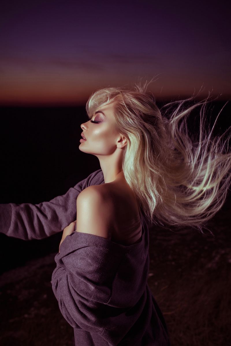 woman wearing gray jacket with blonde hair