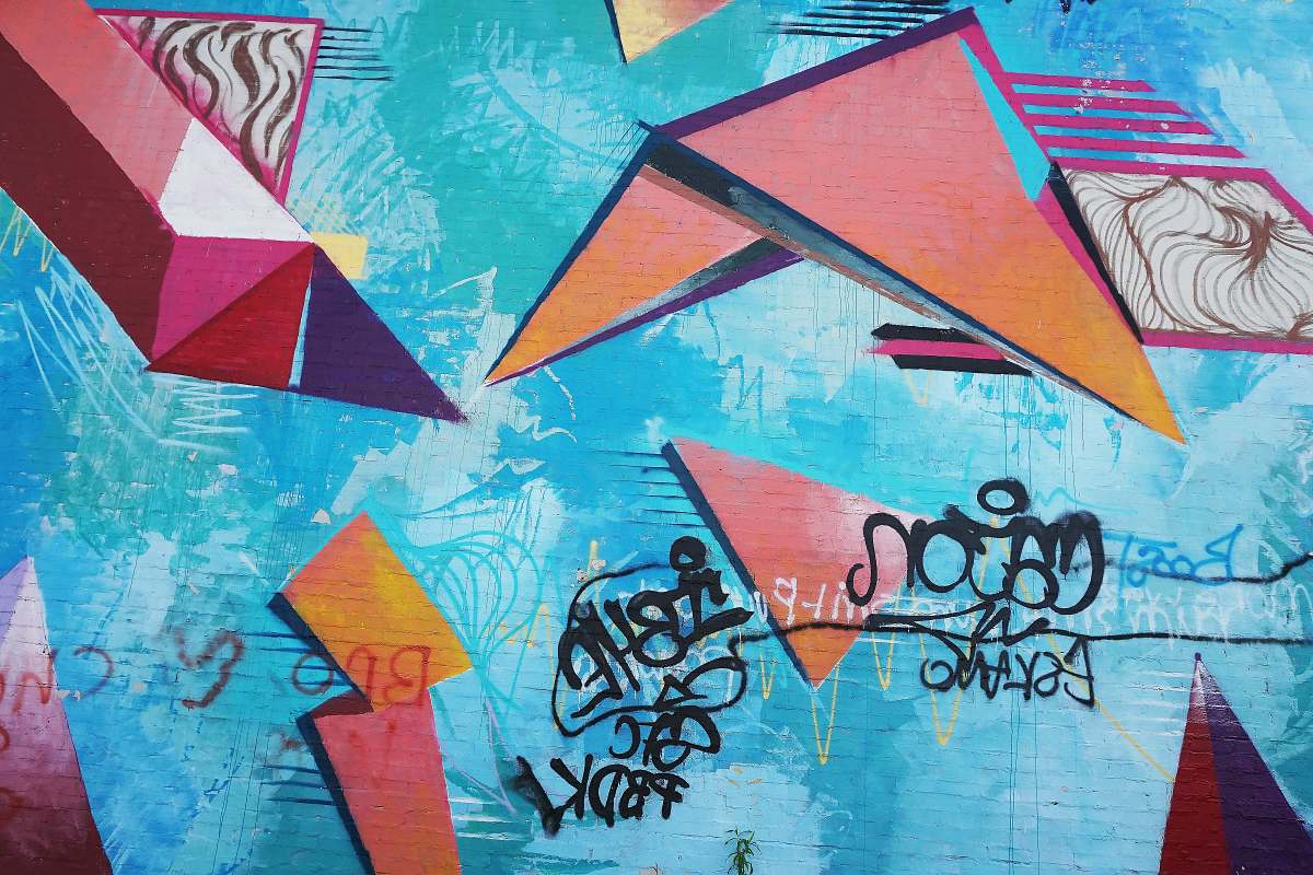 graffiti blue and multicolored wall full of graffitis wall