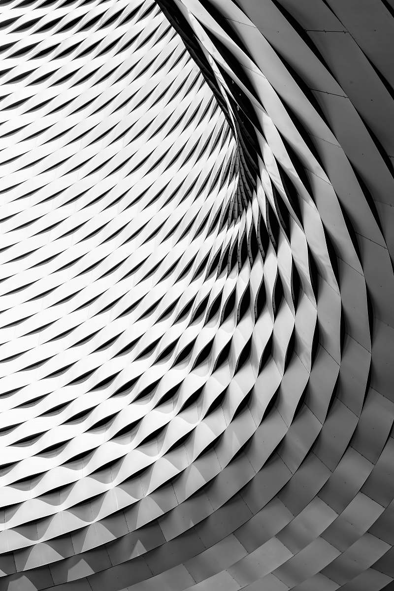 pattern A curved facade covered in white latticework texture