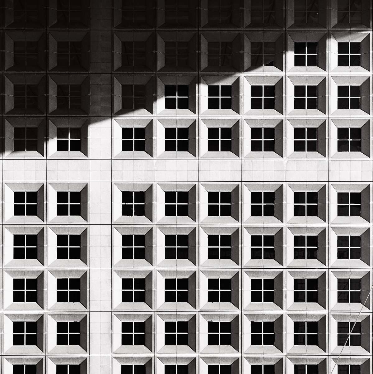 window architectural photography of white building architecture