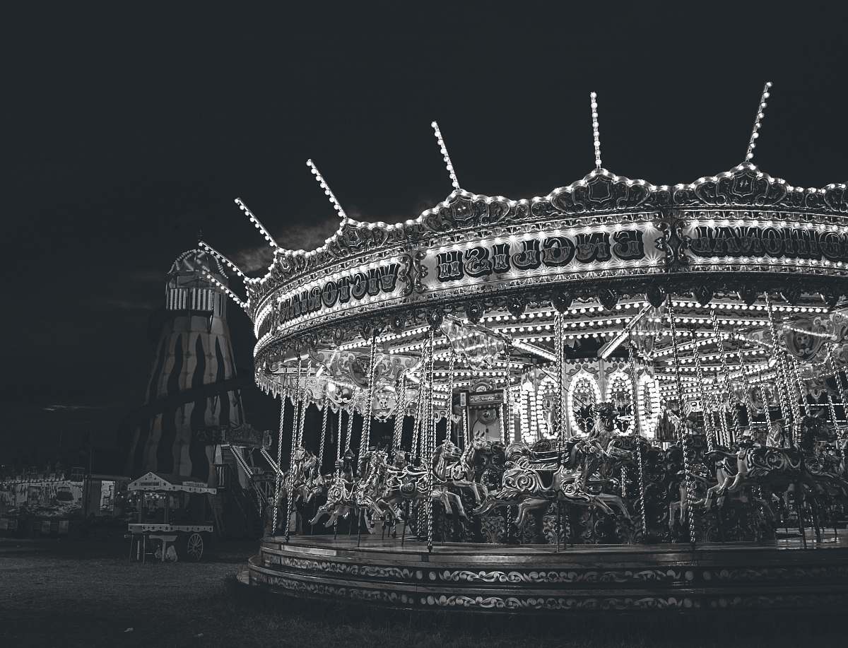carousel grayscale photo of carousel arena