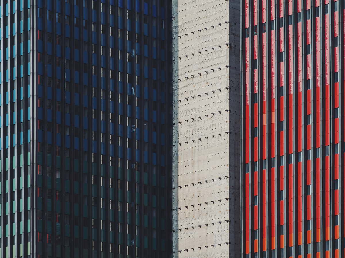 urban blue, white, and red commercial buildings city