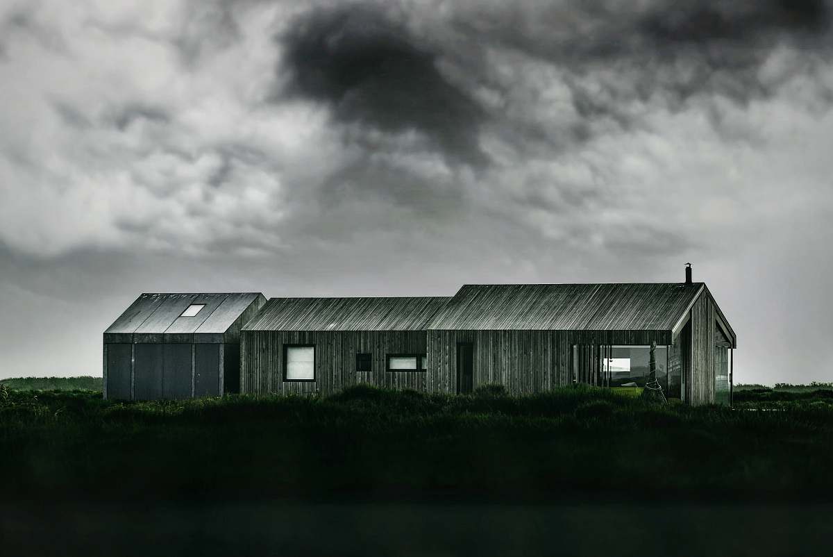 rural grayscale photo of wooden barn outdoors
