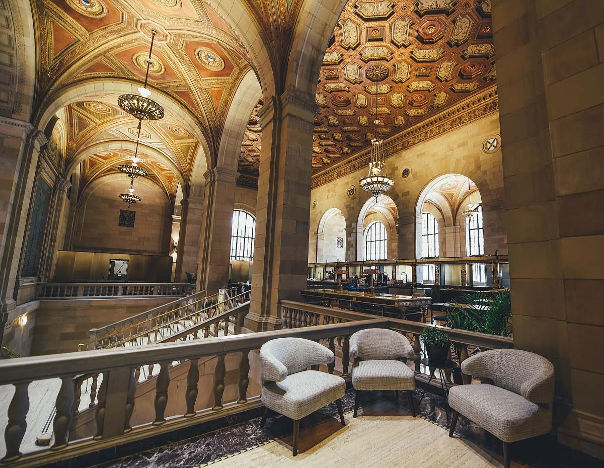 interior three fabric chairs near balustrade furniture