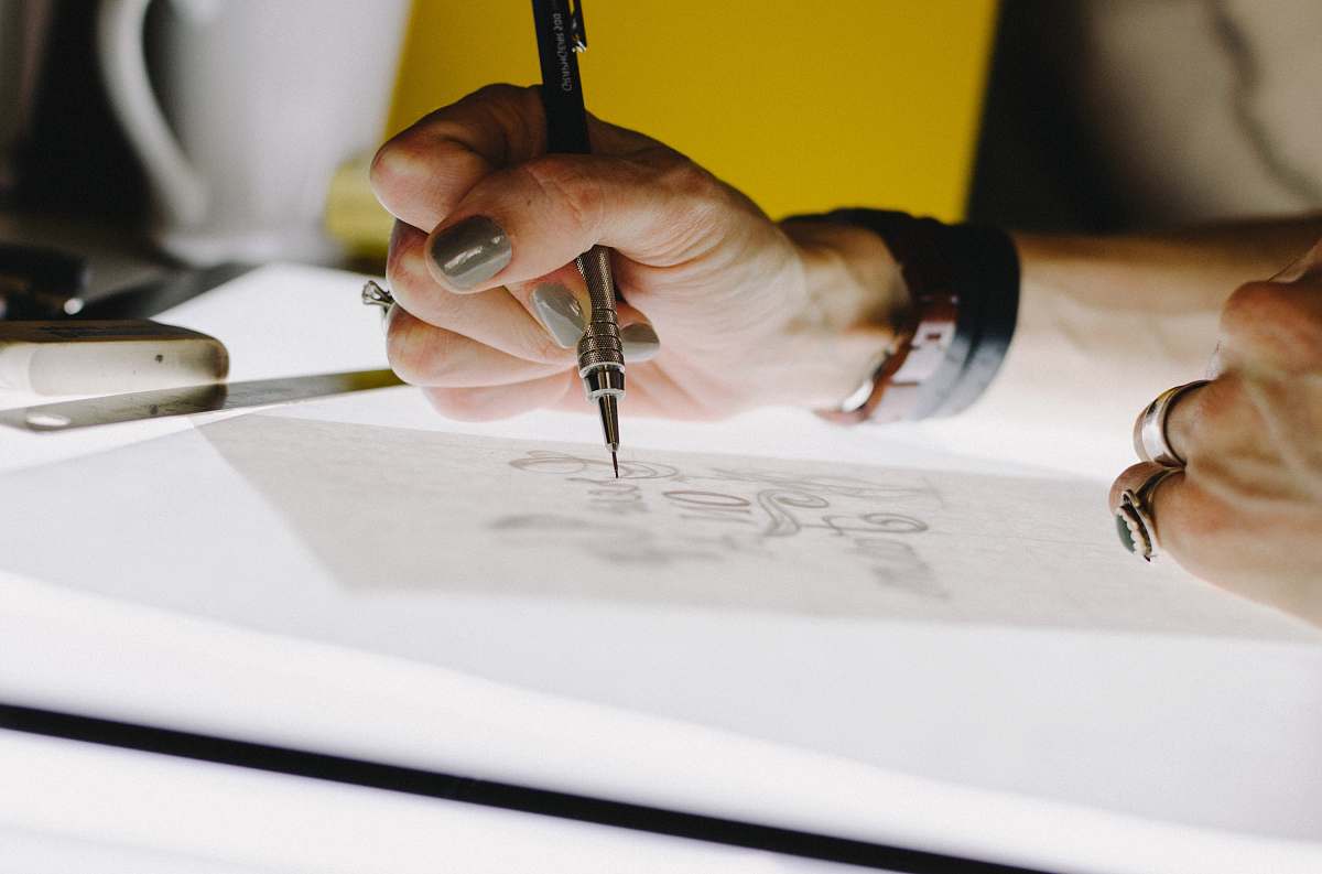 ring person lettering on tracing paper using mechanical pencil jewelry