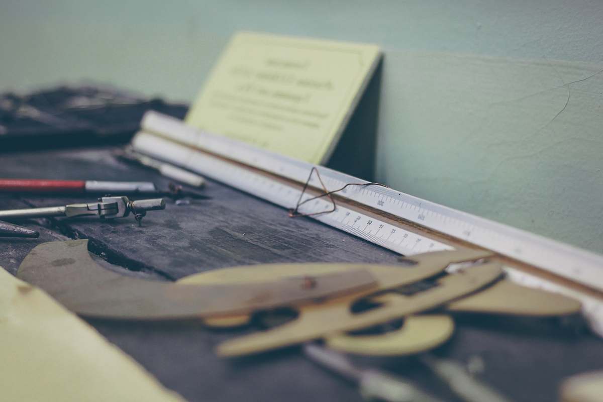 pencil white ruler on desk compass