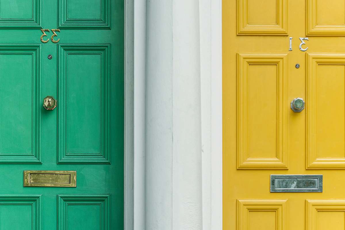 color green door beside yellow door yellow
