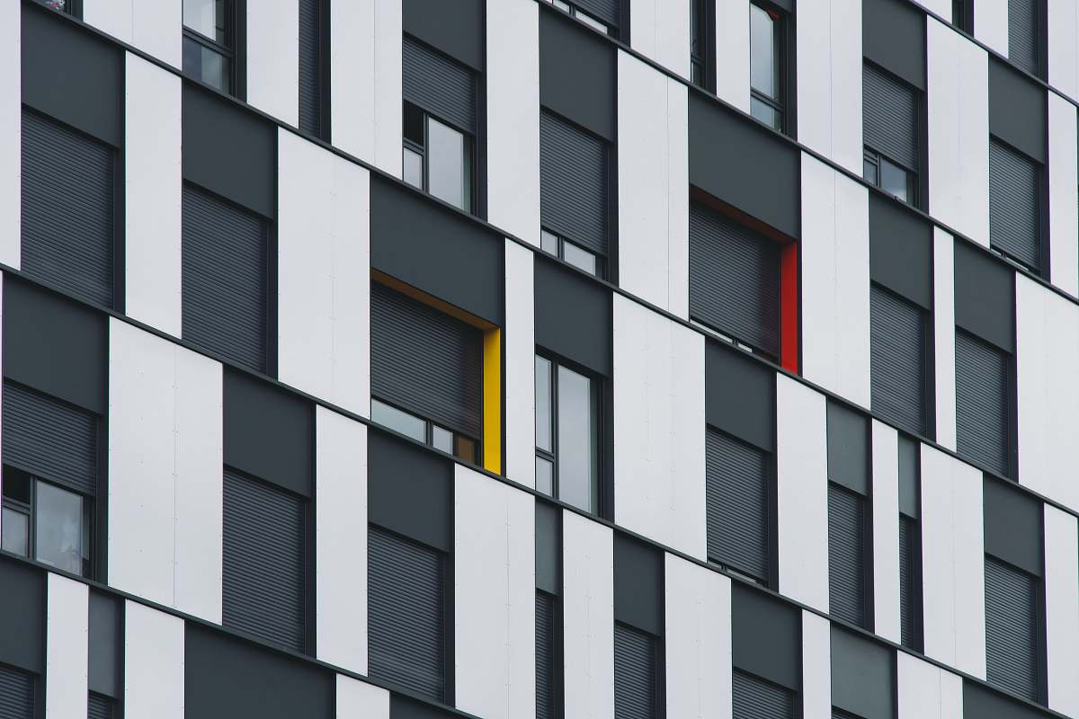 brown architectural photograph of glass wall building grey