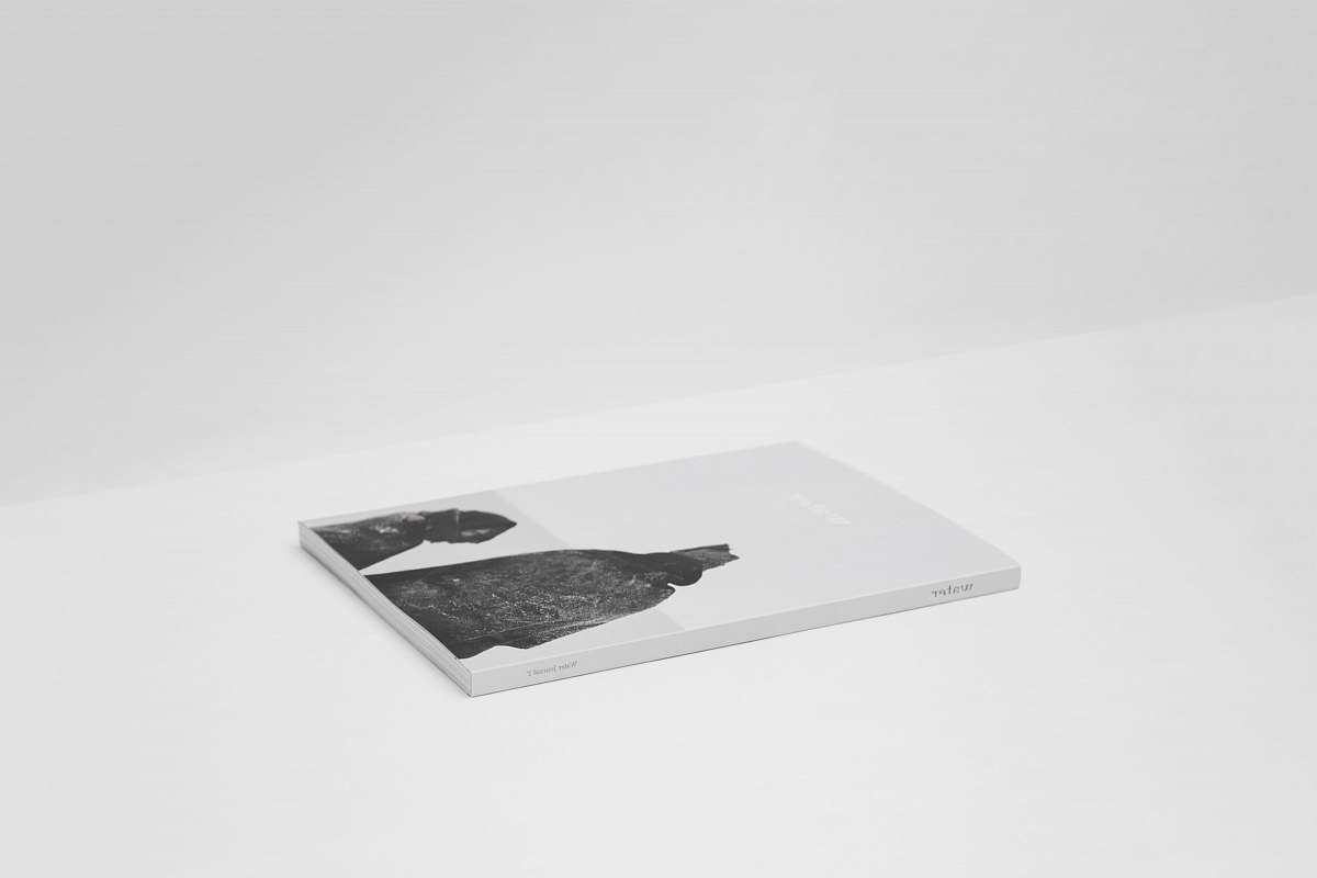 black-and-white book on top of white surface minimal
