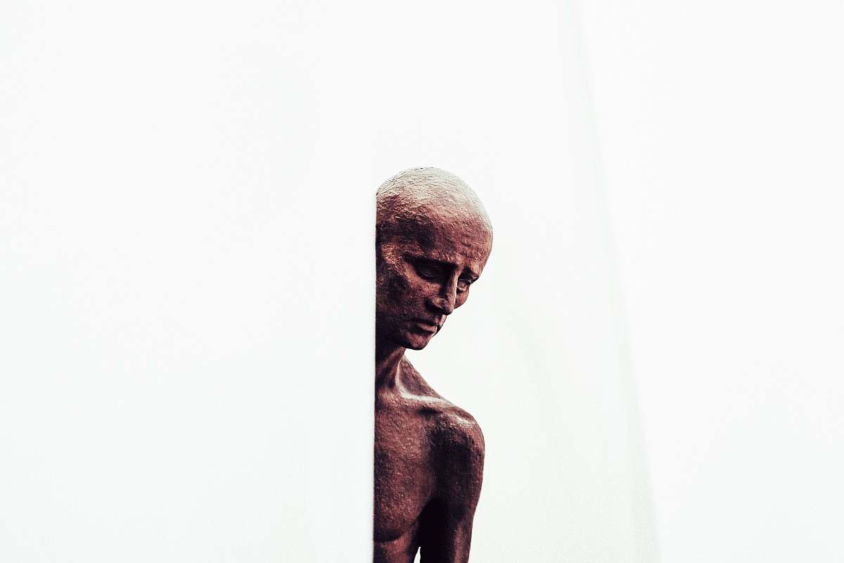 sculpture man on white wall person