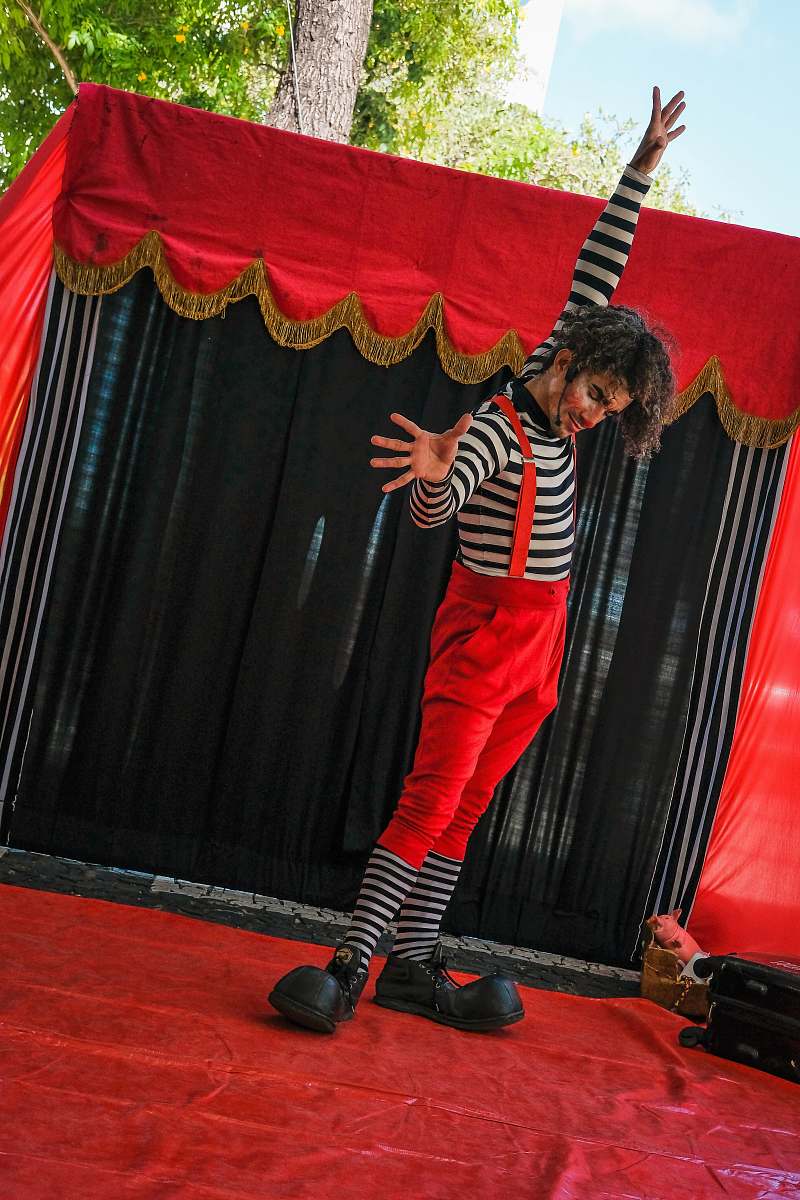 person man standing on stage footwear