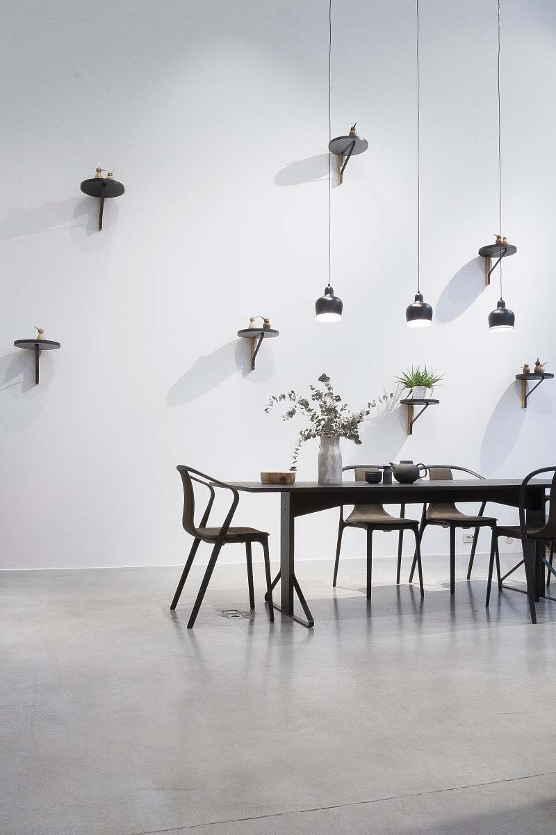 table black dining set near white wall black-and-white