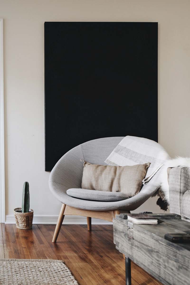 home round grey moon chair with brown pillow on top design