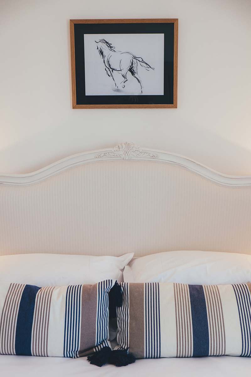 art white and multicolored striped bed pillows cushion