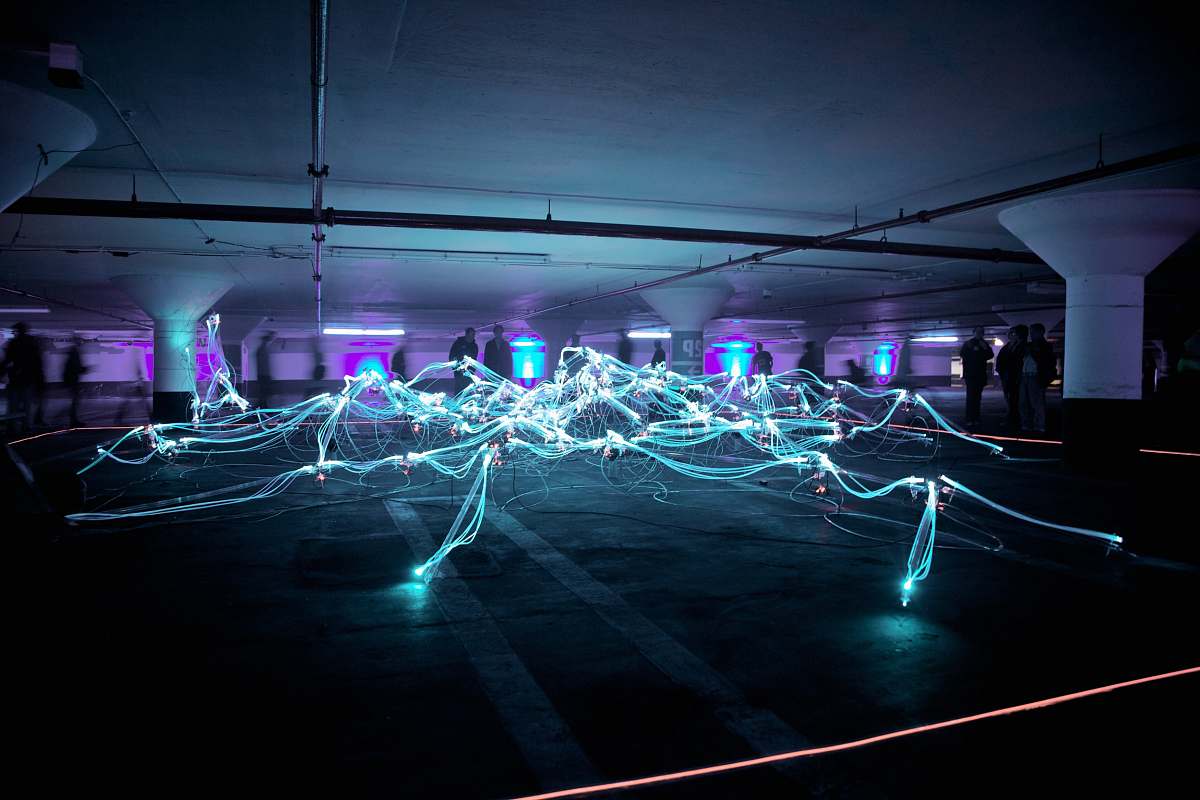 laser linked neon lights under white painted basement electricity