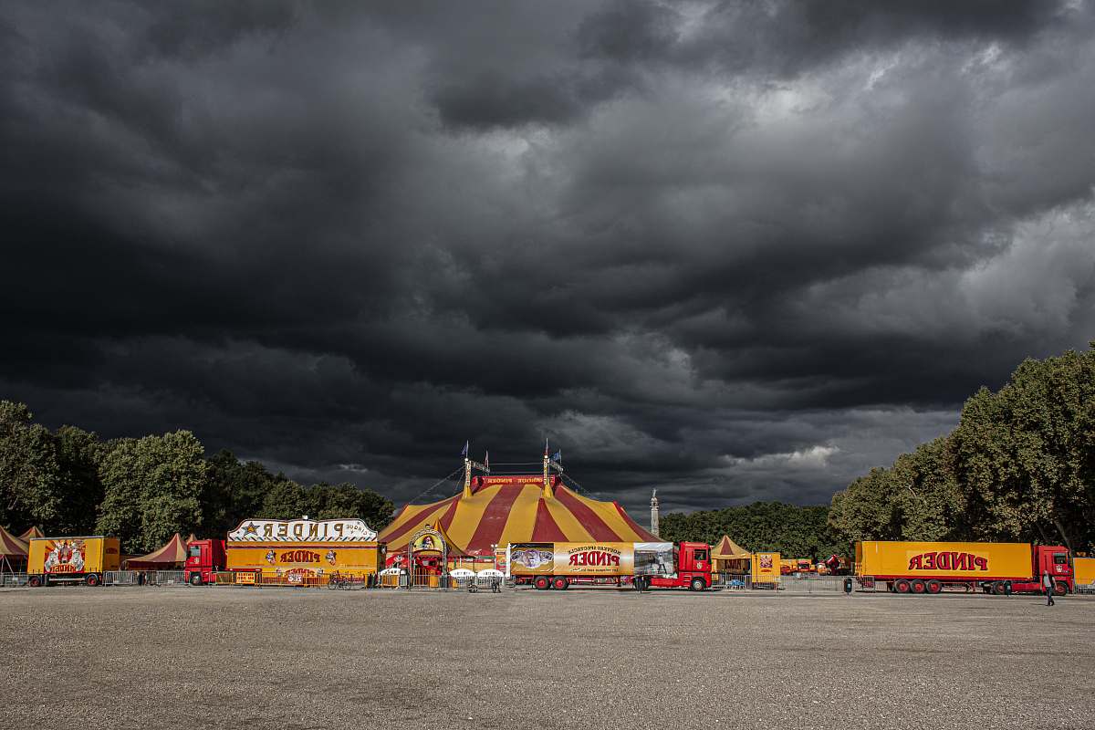 weather circus underneath cumulus clouds urban
