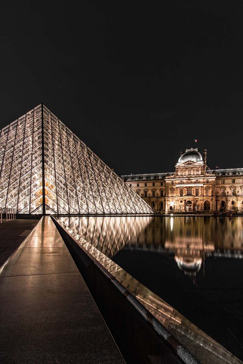 architecture glass building during nighttime triangle