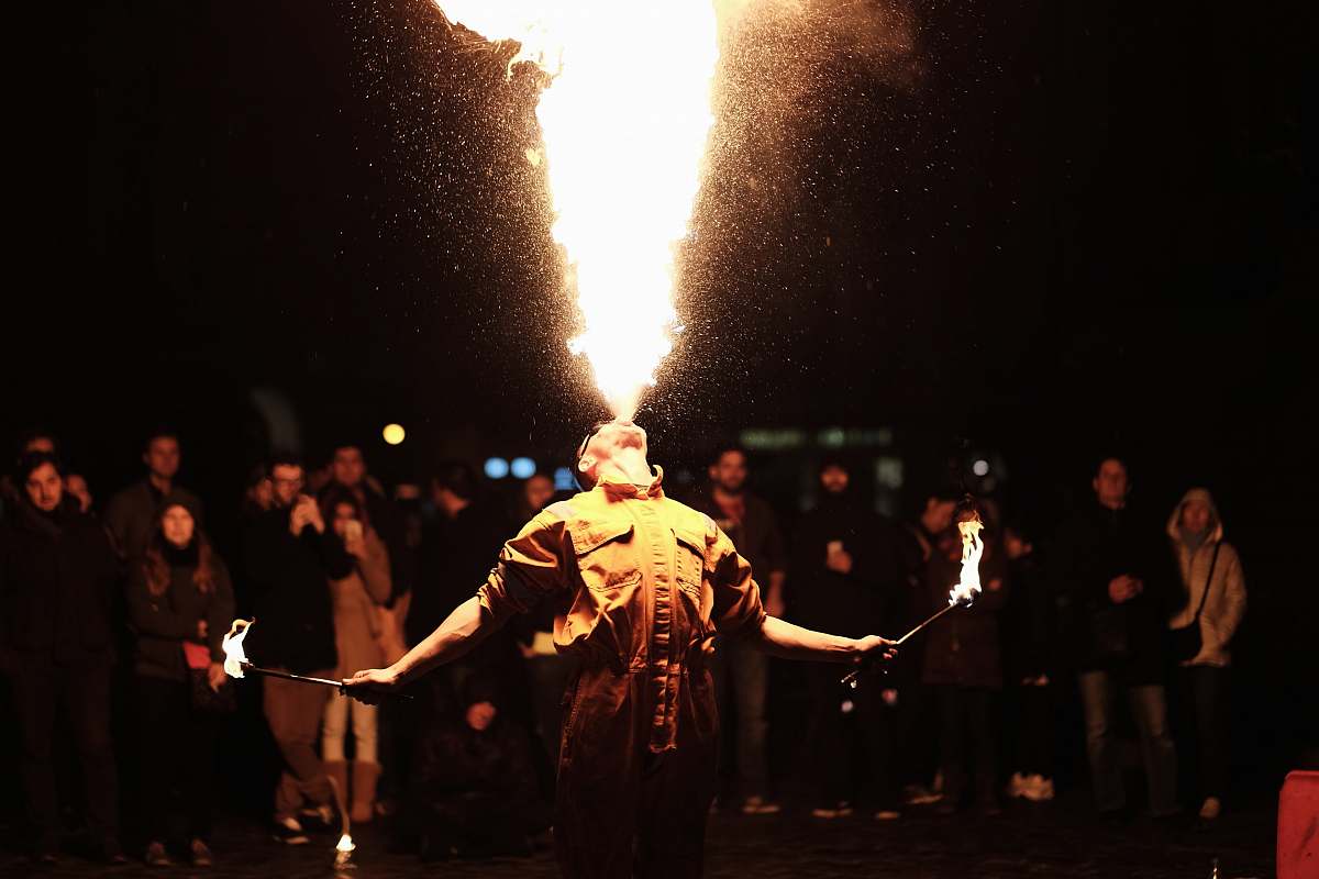 people person breathing fire performer