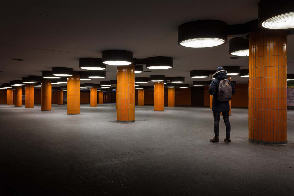 building person standing in parking lot architecture
