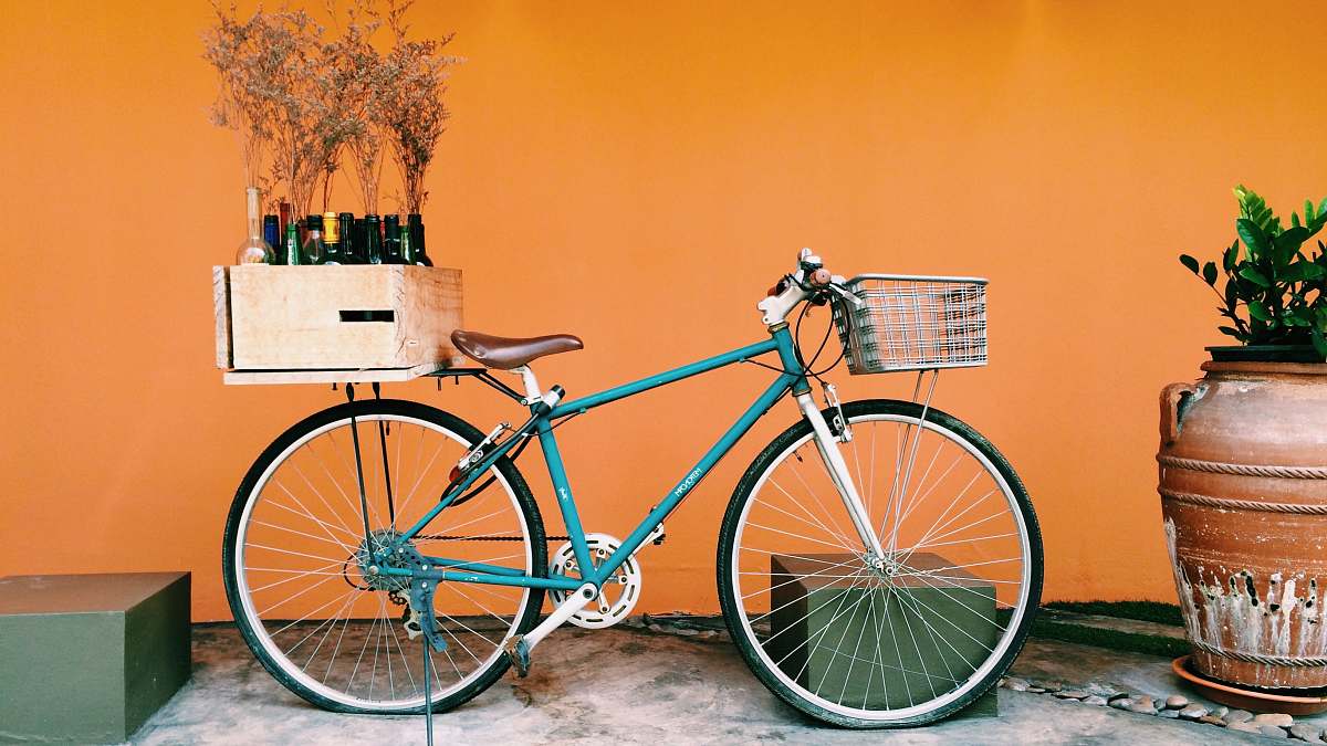 bike blue and black city bike on white flooring bicycle