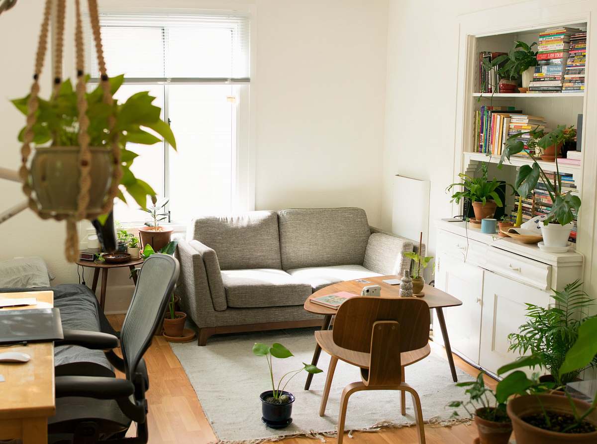 interior gray fabric loveseat near brown wooden table home