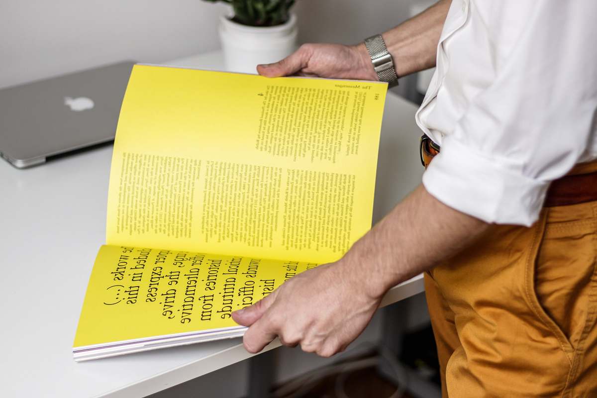yellow person holding book book