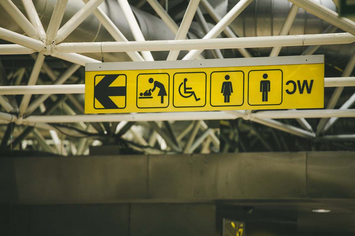 building white WC building signage yellow