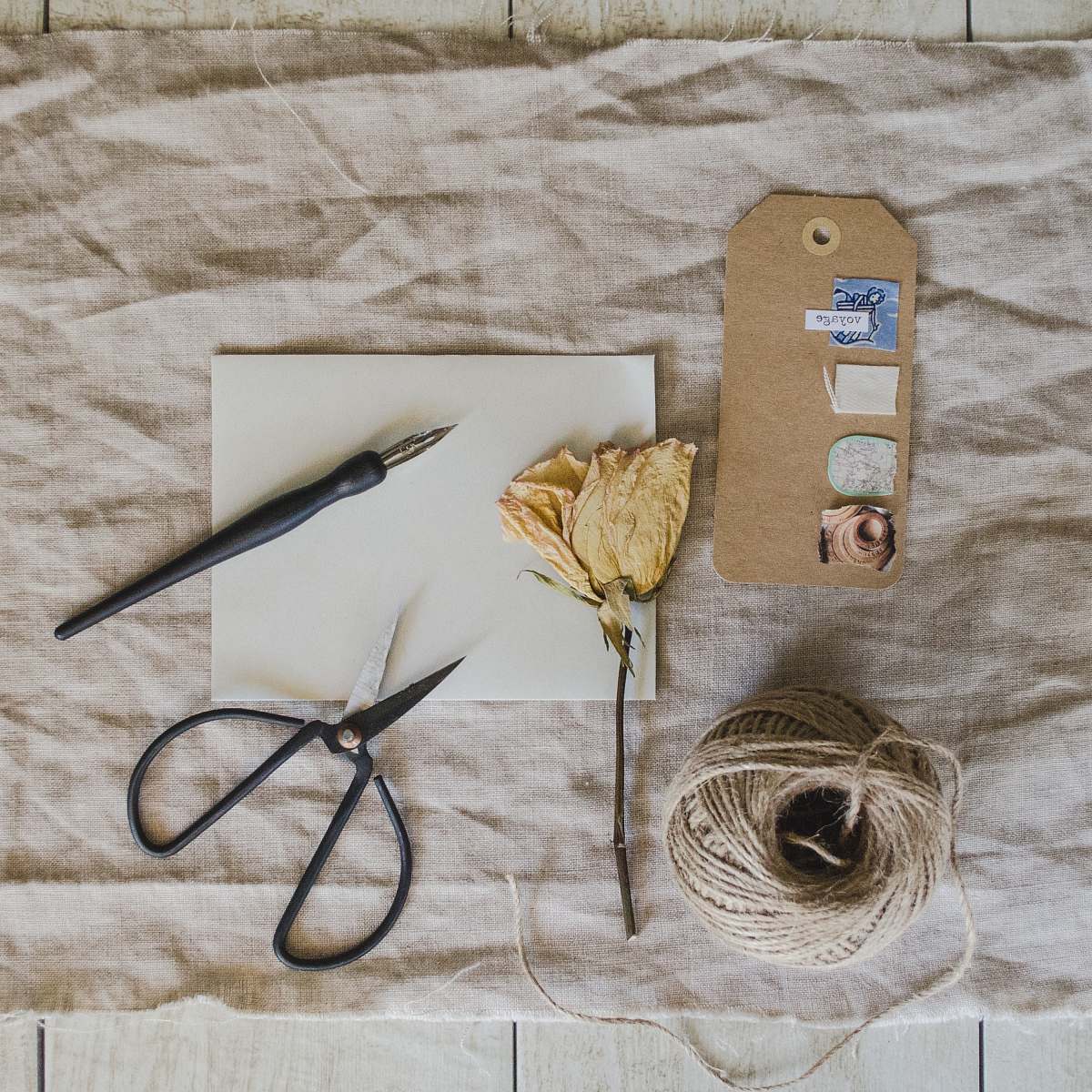 flatlay black fountain pen above white paper ephemera