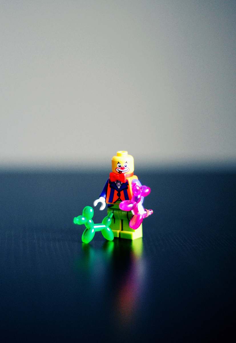 figurine selective photography of Clown minifig toy clown