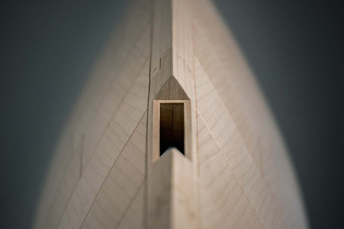 architecture closeup photography of wooden coin bank bell tower