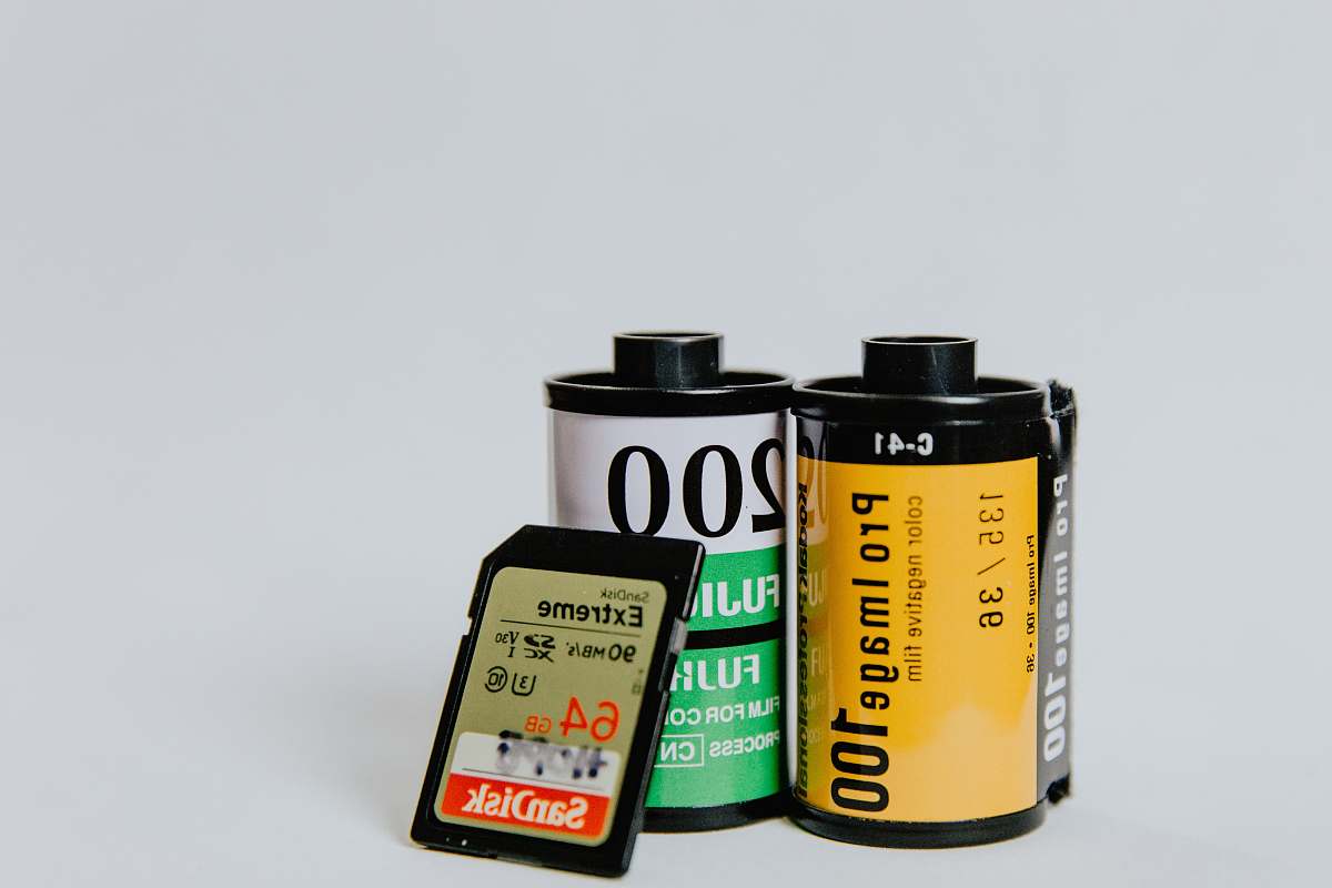 label two camera films and 64 GB memory card kodak film
