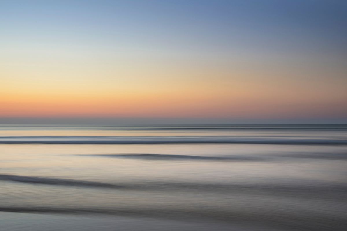 calm sea under golden clouds