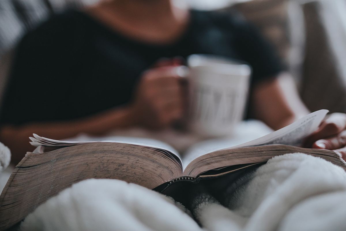 person holding coffee mug