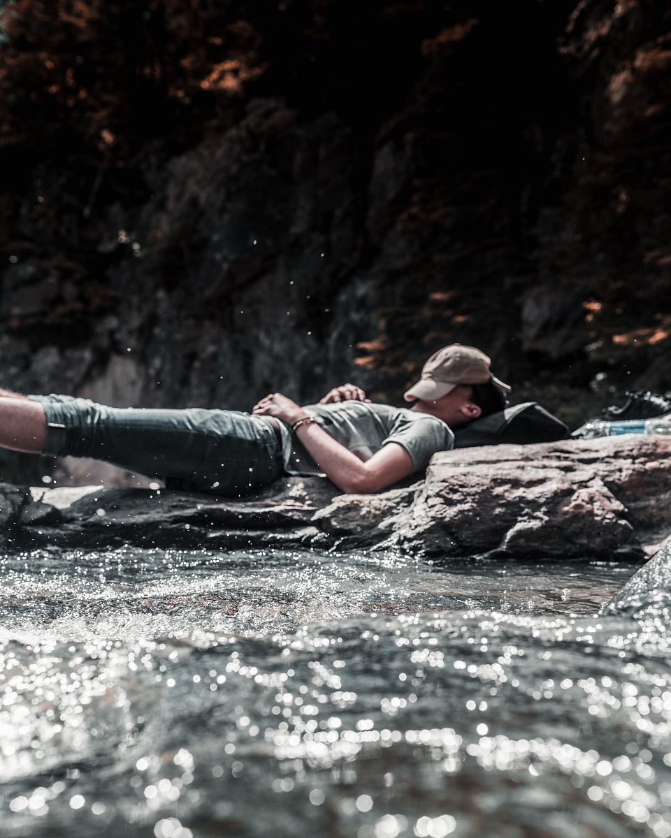 person sleeping on river