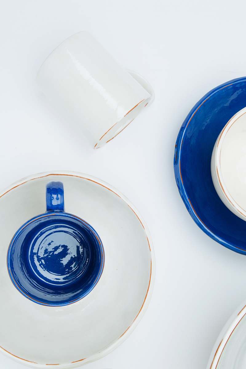 pottery white and blue ceramic teacup and saucer saucer
