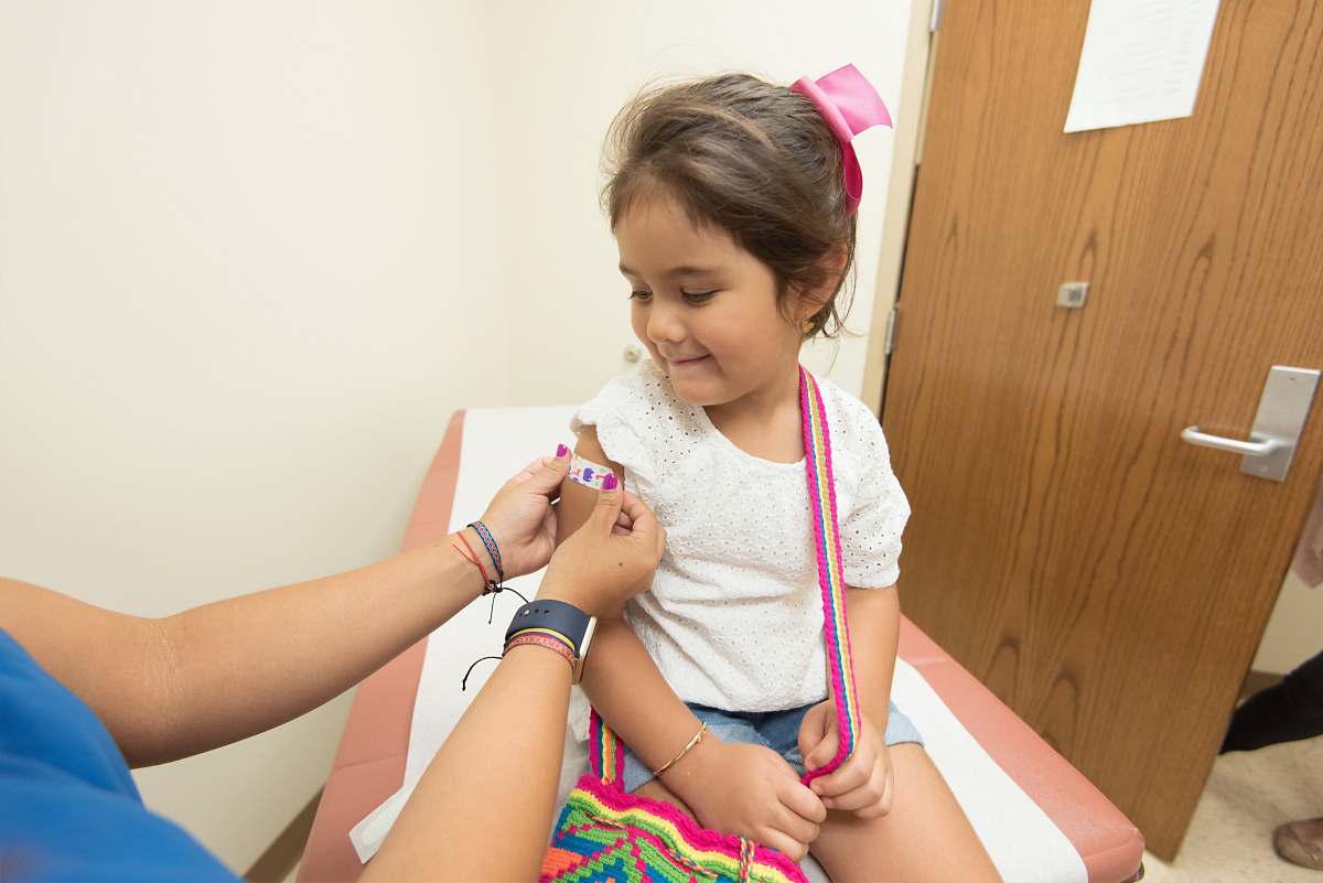 girl girl getting vaccine child