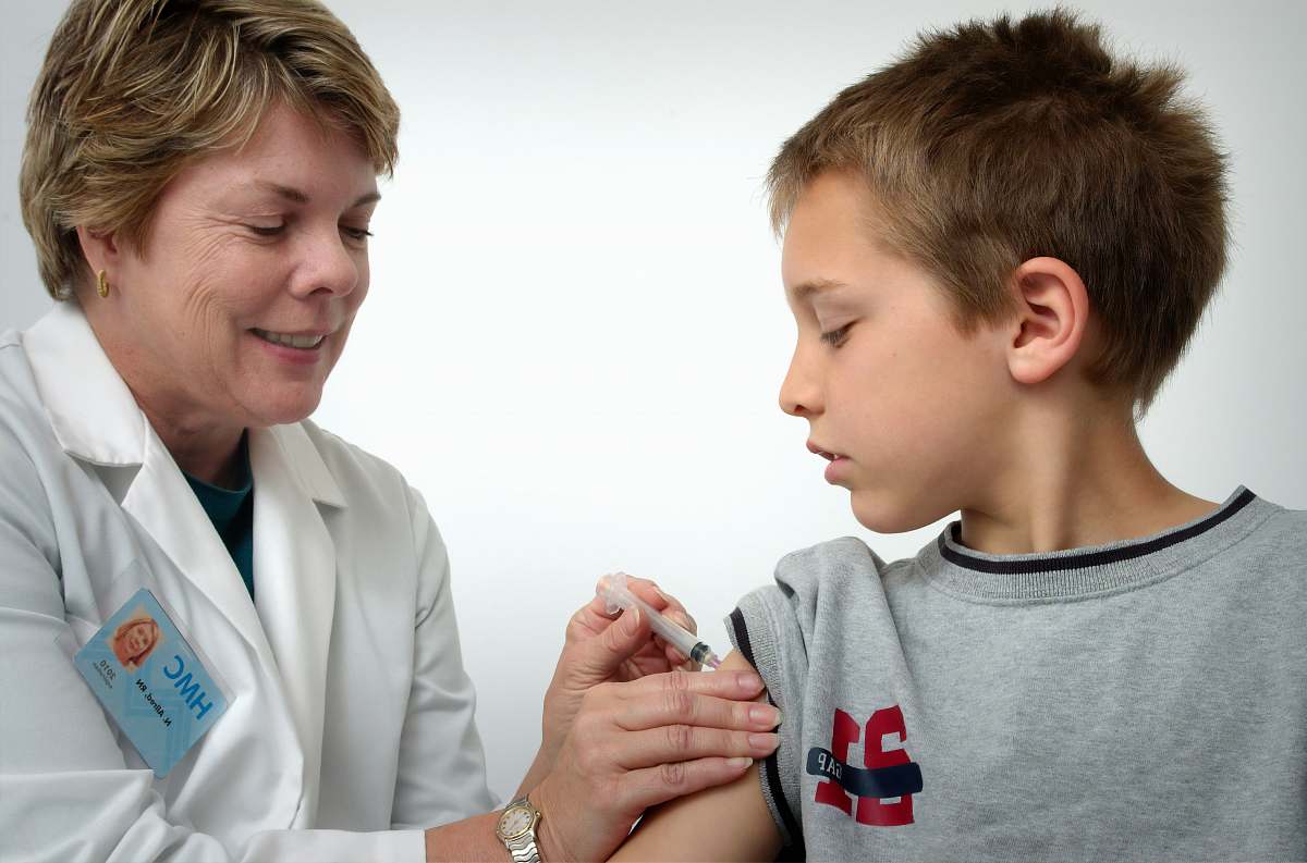 apparel woman inject boy on arm human