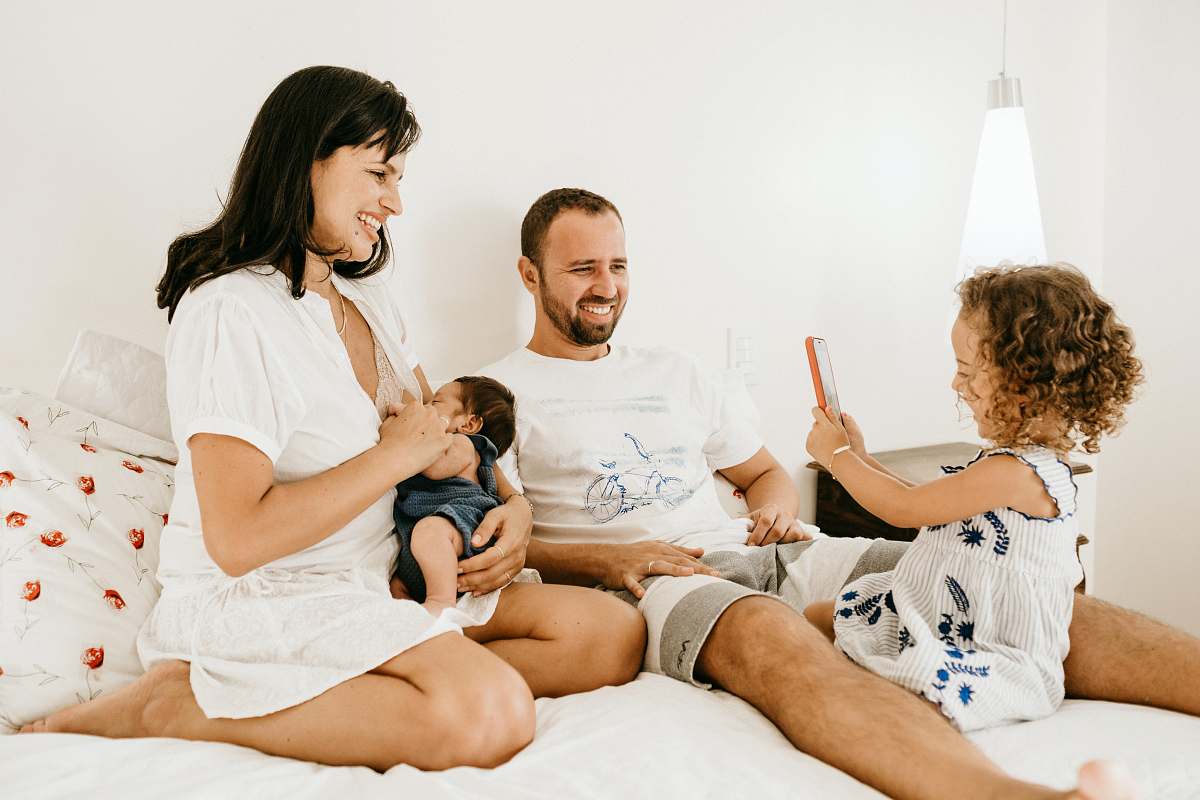  man in white crew neck t-shirt sitting beside woman in white crew neck t-shirt 