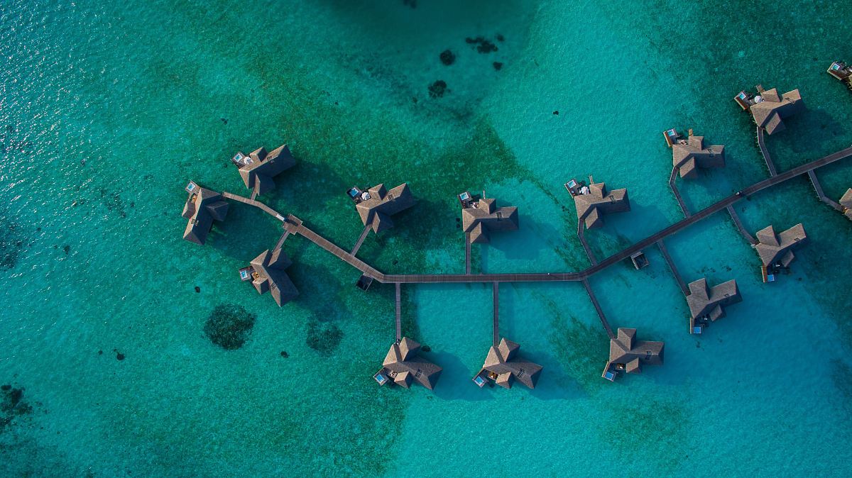 aerial photography of resort villa on water