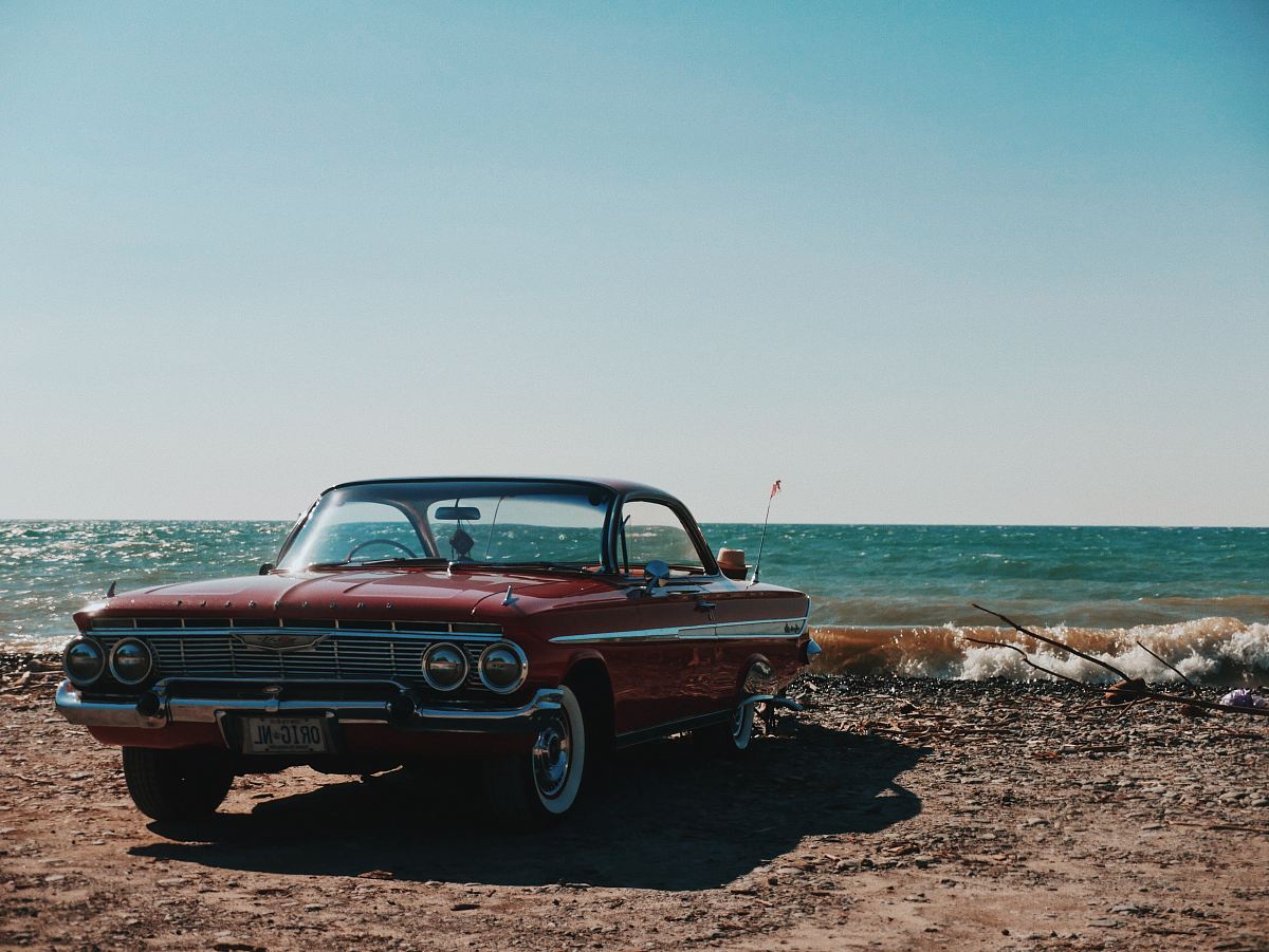 black and grey coupe parked near seashore during daytime